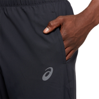 ASICS CORE WOVEN PANT - Tracksuit bottoms - performance black