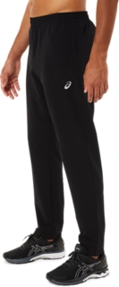 ASICS CORE WOVEN PANT - Tracksuit bottoms - performance black/black 