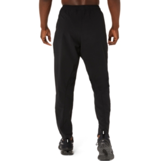 ASICS CORE WOVEN PANT - Tracksuit bottoms - performance black